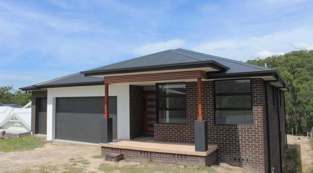 A newly-built bungalow with brick walls.